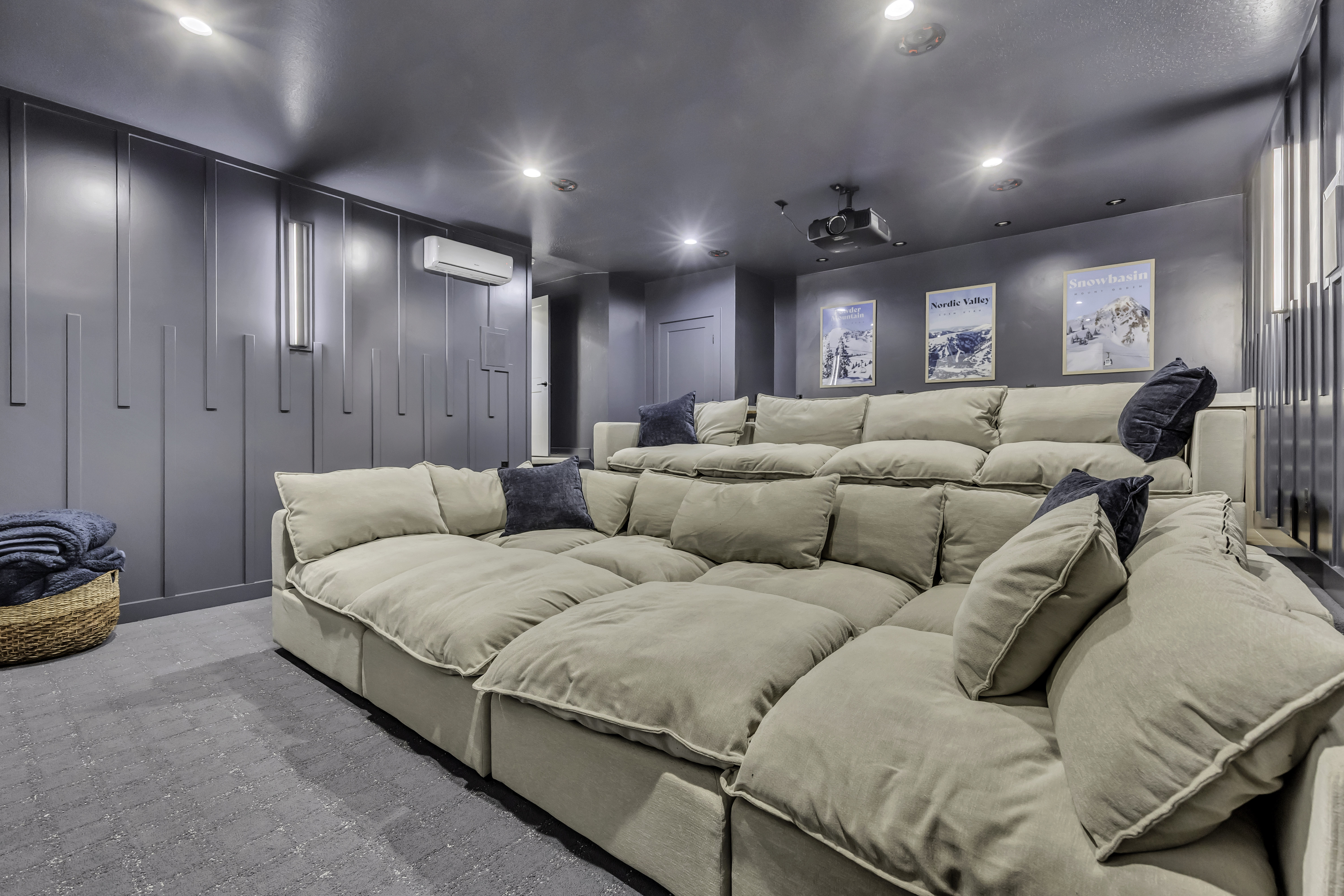 Home theater with recessed lighting, a wall mounted mini split, and light colored carpet