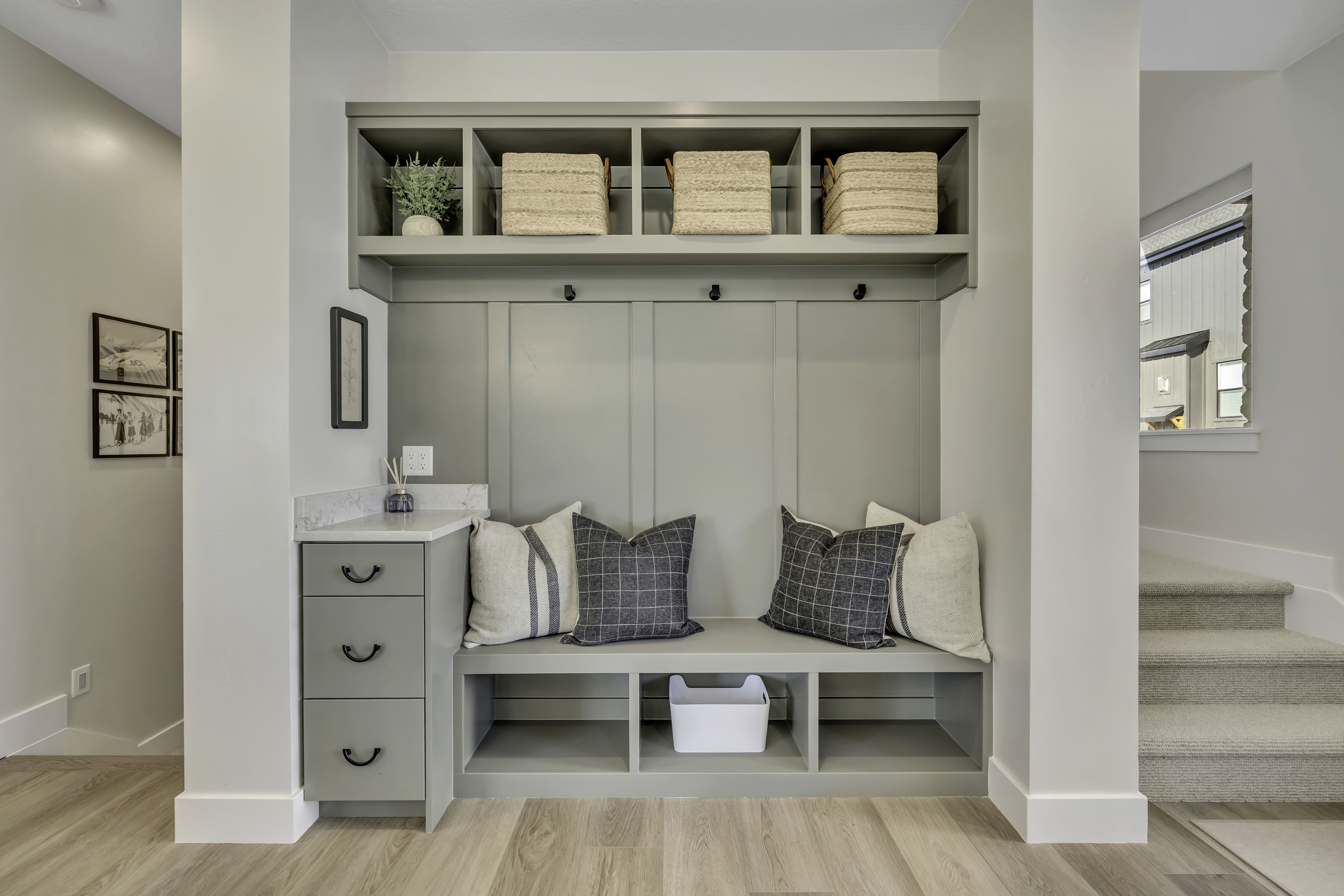 Mudroom with light wood-style flooring and baseboards