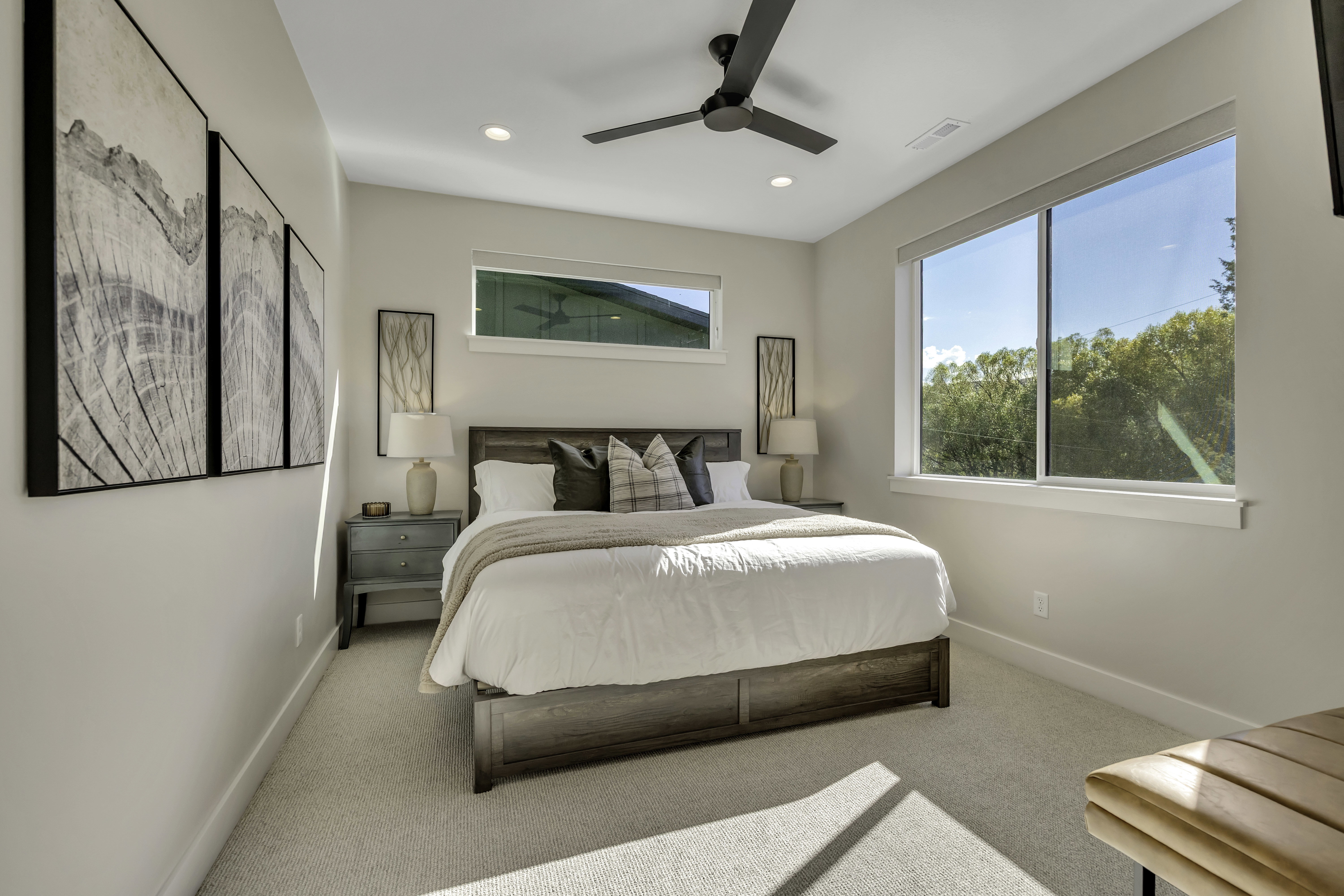 Carpeted bedroom with ceiling fan and recessed lighting