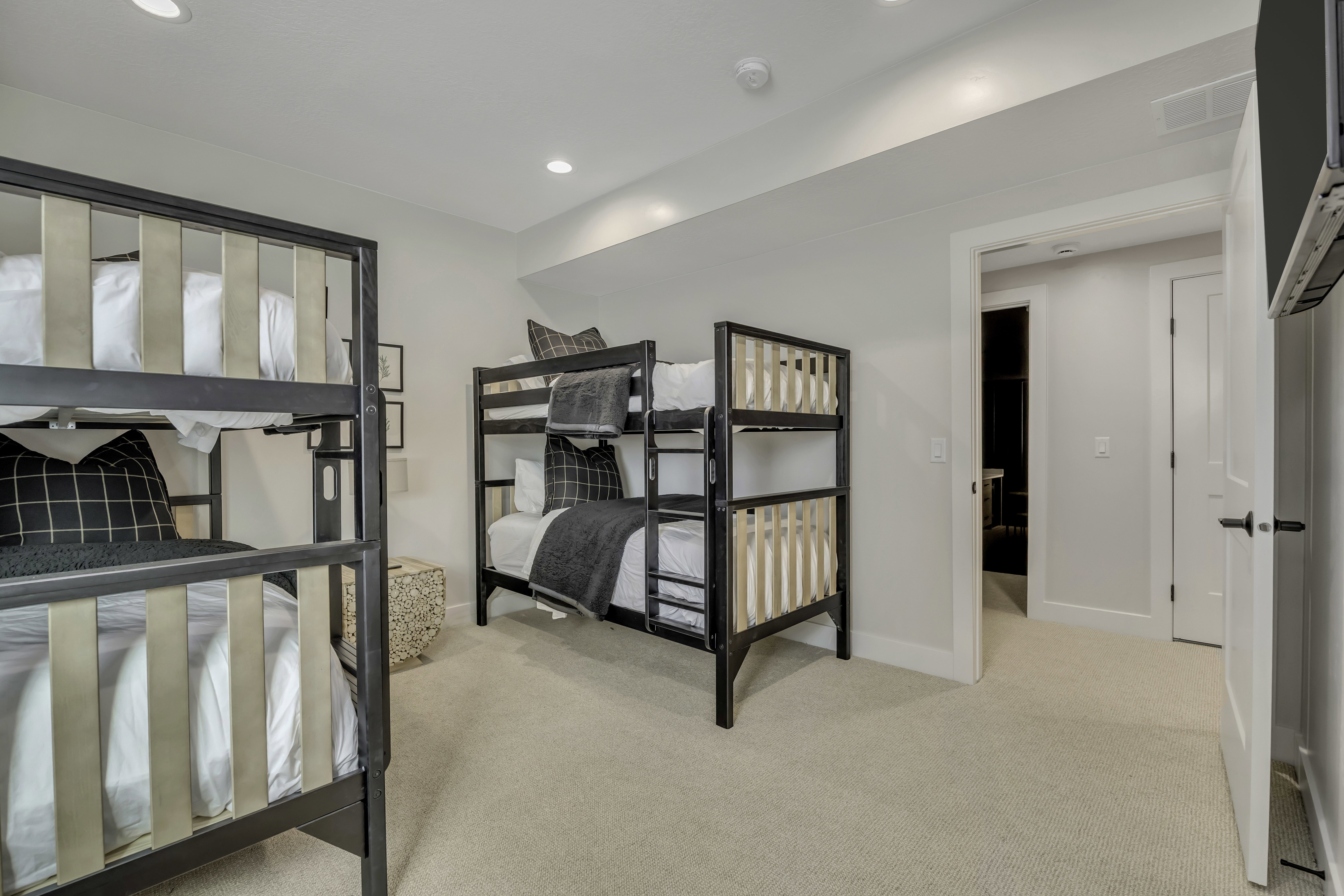 Bedroom with light carpet and recessed lighting