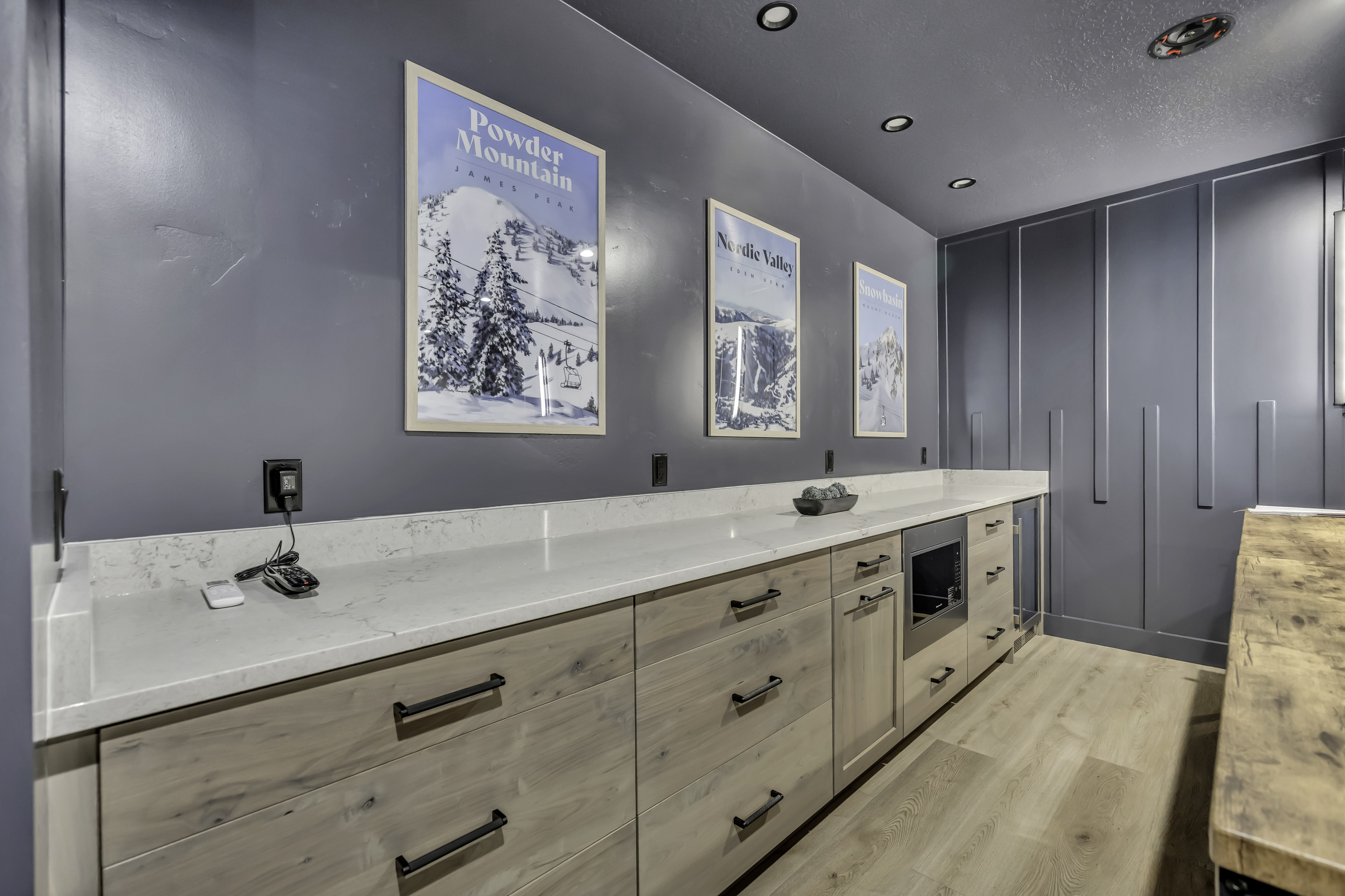 Full bath with vanity, light wood finished floors, recessed lighting, and a textured ceiling