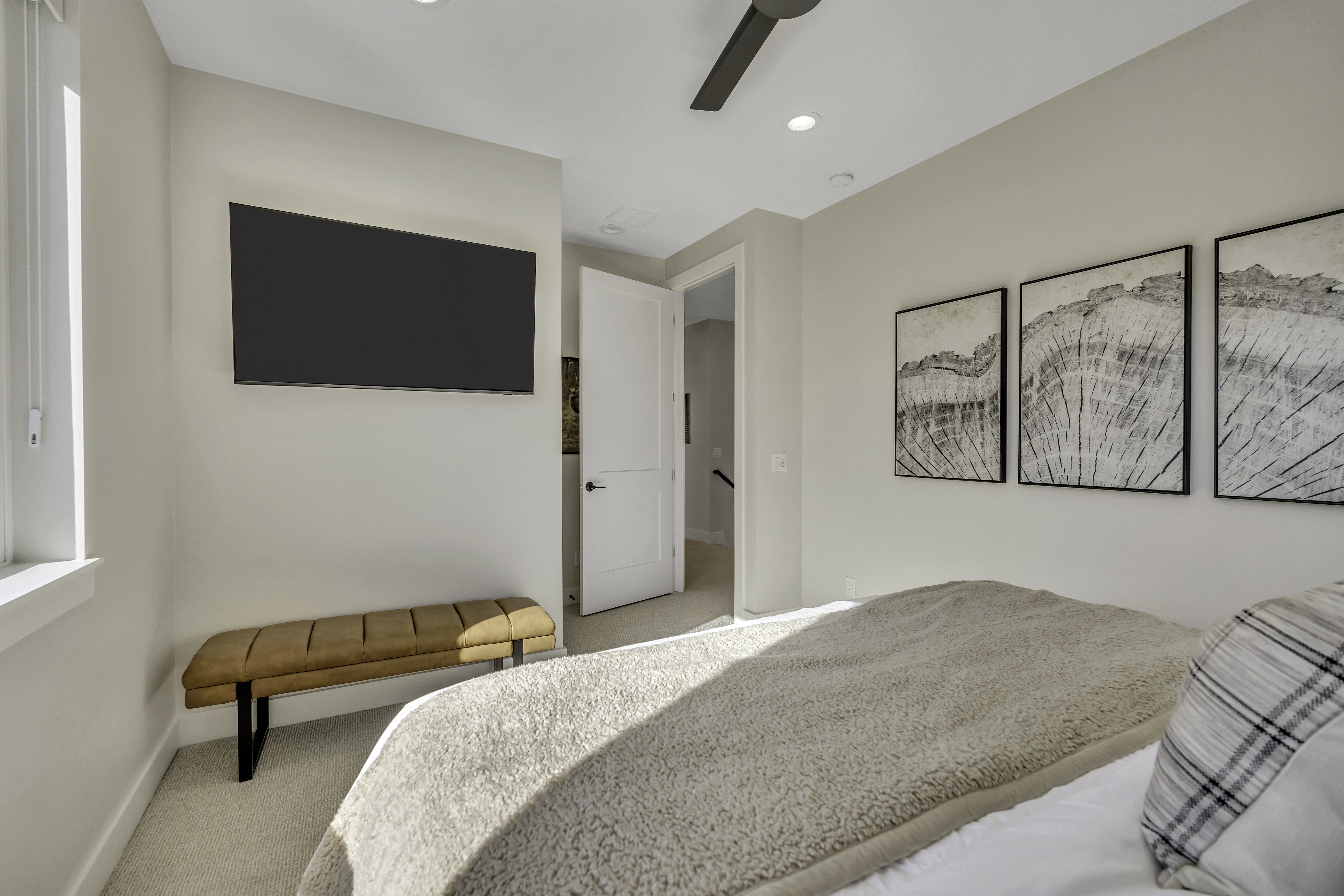 Bedroom with light carpet, a ceiling fan, and recessed lighting