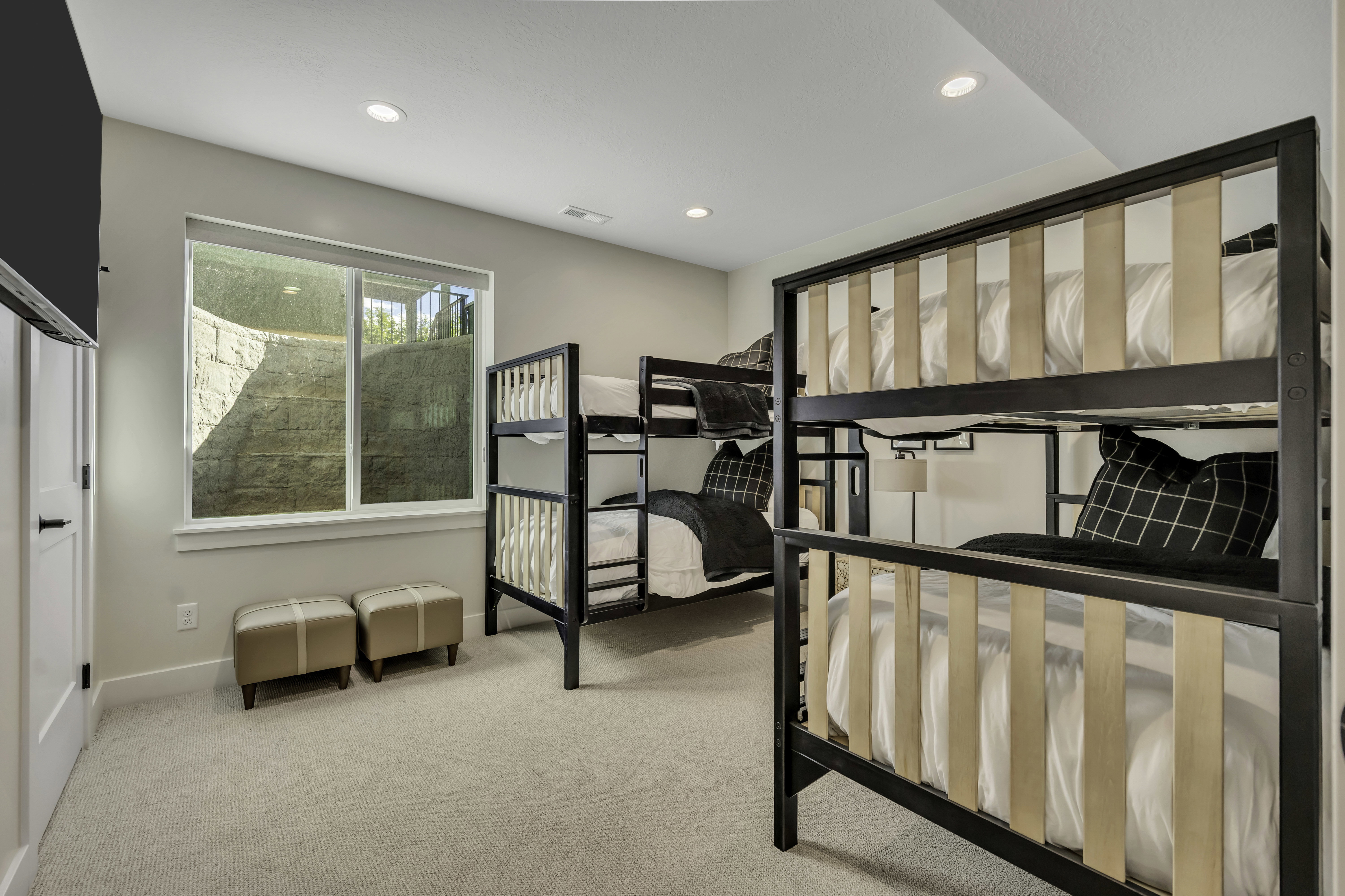 Bedroom with light colored carpet and recessed lighting