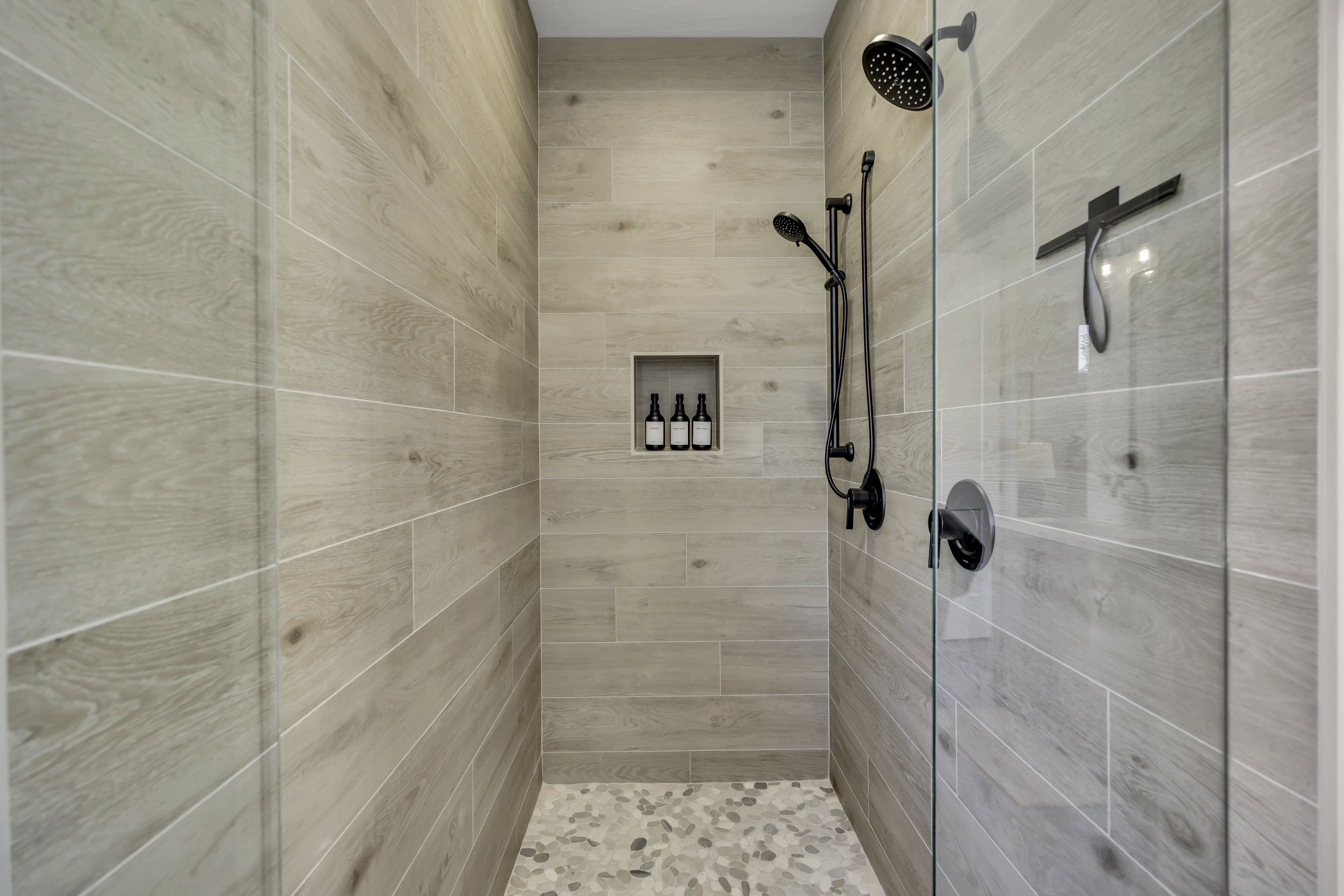Full bathroom featuring a stall shower