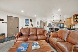 Open-concept living space featuring recessed lighting and wood-finish flooring