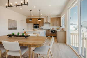 Open-concept living area with light wood-finish flooring