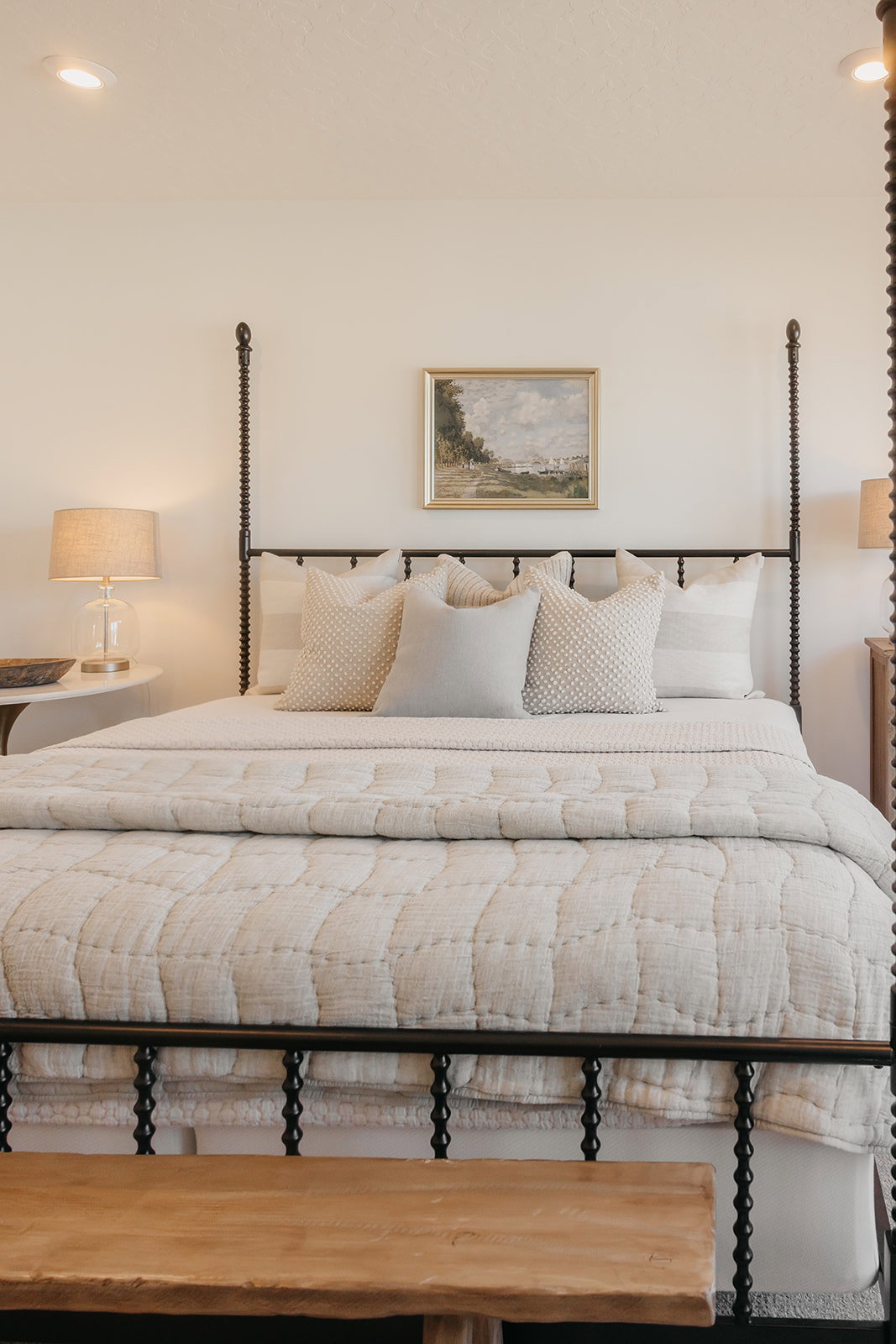 Recessed ceiling lighting illuminates the room's neutral wall tones
