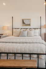 Recessed ceiling lighting illuminates the room's neutral wall tones