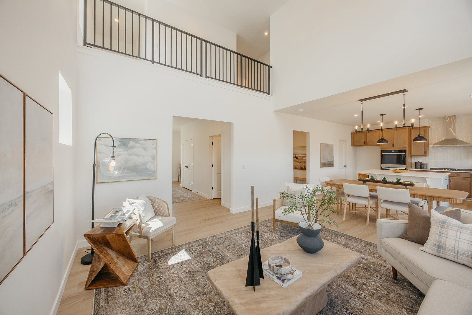 Expansive double-height living space with light wood-finish flooring