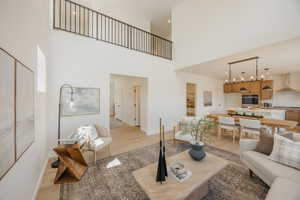 Expansive double-height living space with light wood-finish flooring