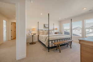 Carpeted interior space featuring white walls and multiple windows with white trim