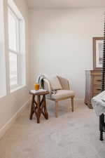 Bright interior space with light-toned walls and plush carpeting