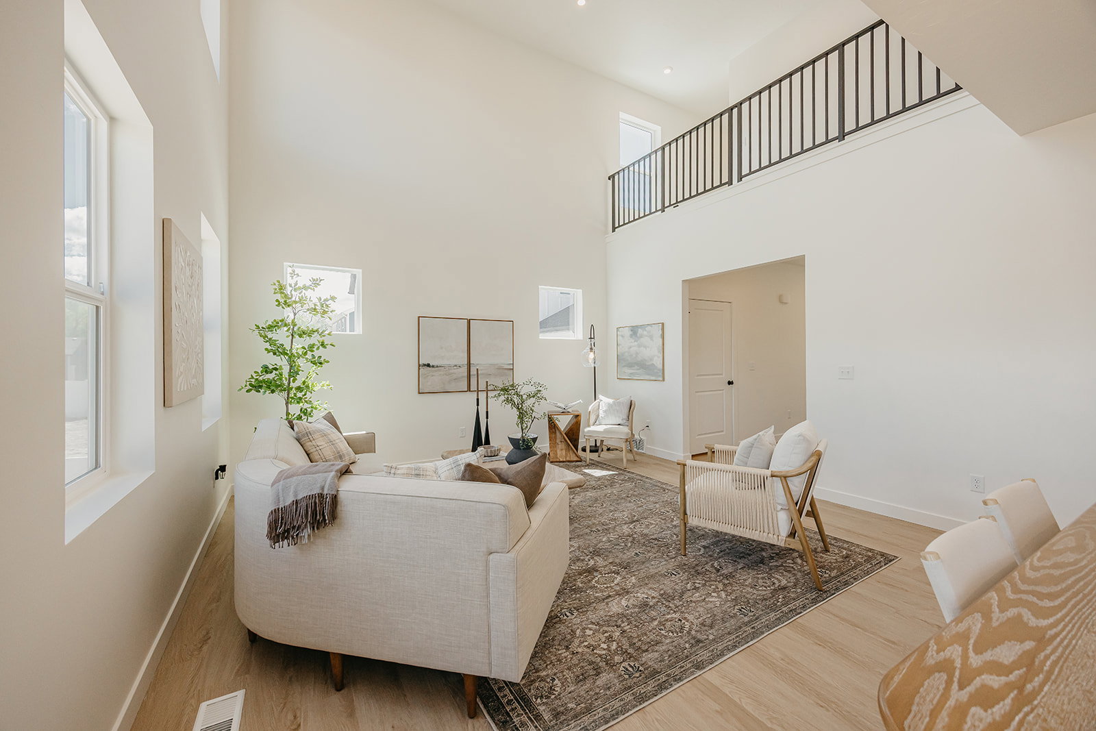 Vaulted ceilings with abundant natural light from multiple windows