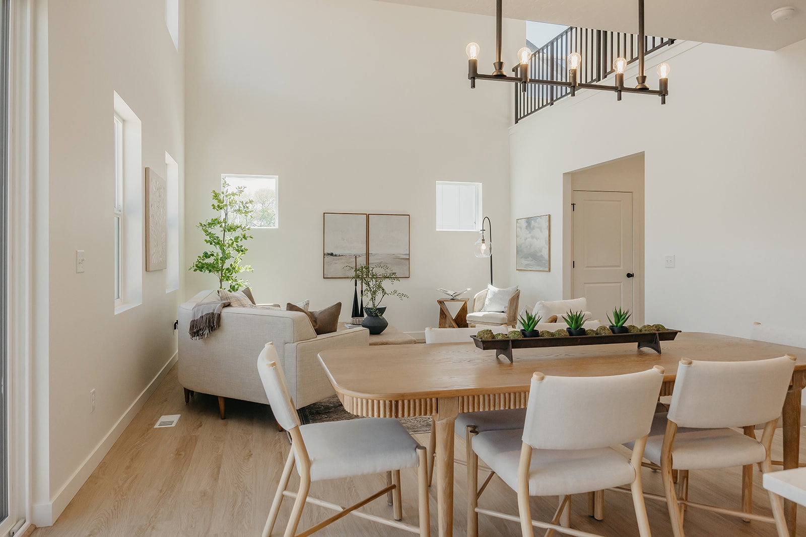 Open-concept living space with high ceilings and abundant natural light