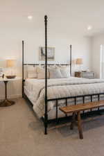 Bright interior space featuring recessed lighting and neutral-toned carpeting