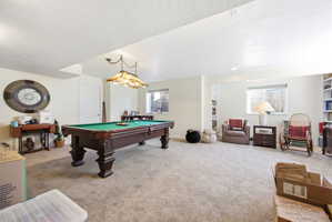 Spacious room featuring neutral carpet flooring and white walls