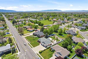 Expansive residential area featuring numerous single-family homes with lush green lawns and mature trees