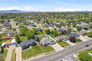 Established residential neighborhood featuring mature trees and mountain scenery