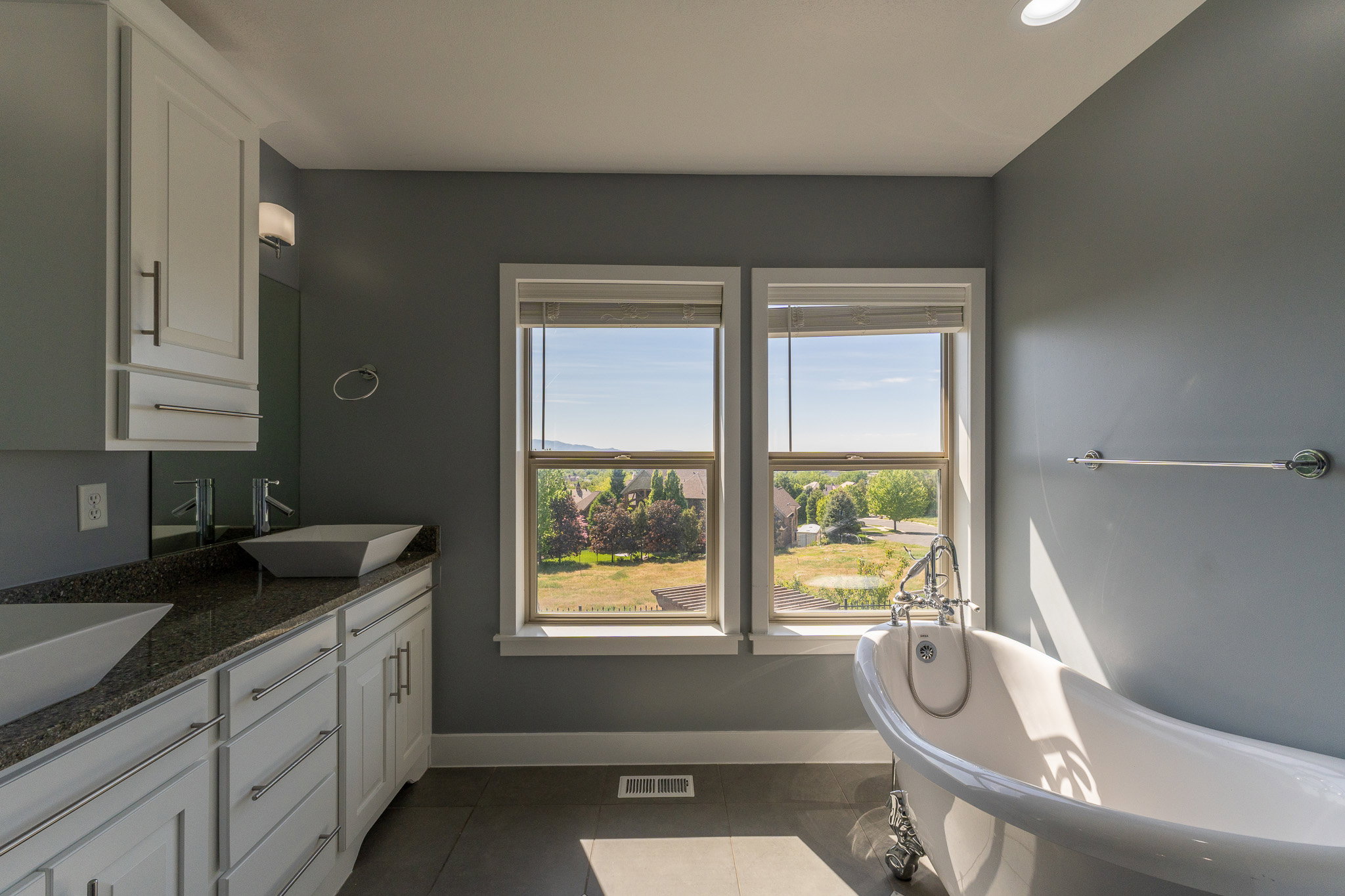 Freestanding clawfoot tub with polished chrome fixtures