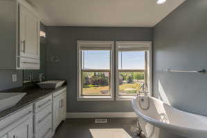 Freestanding clawfoot tub with polished chrome fixtures
