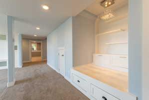 Built-in seating with integrated storage drawers and floating shelves