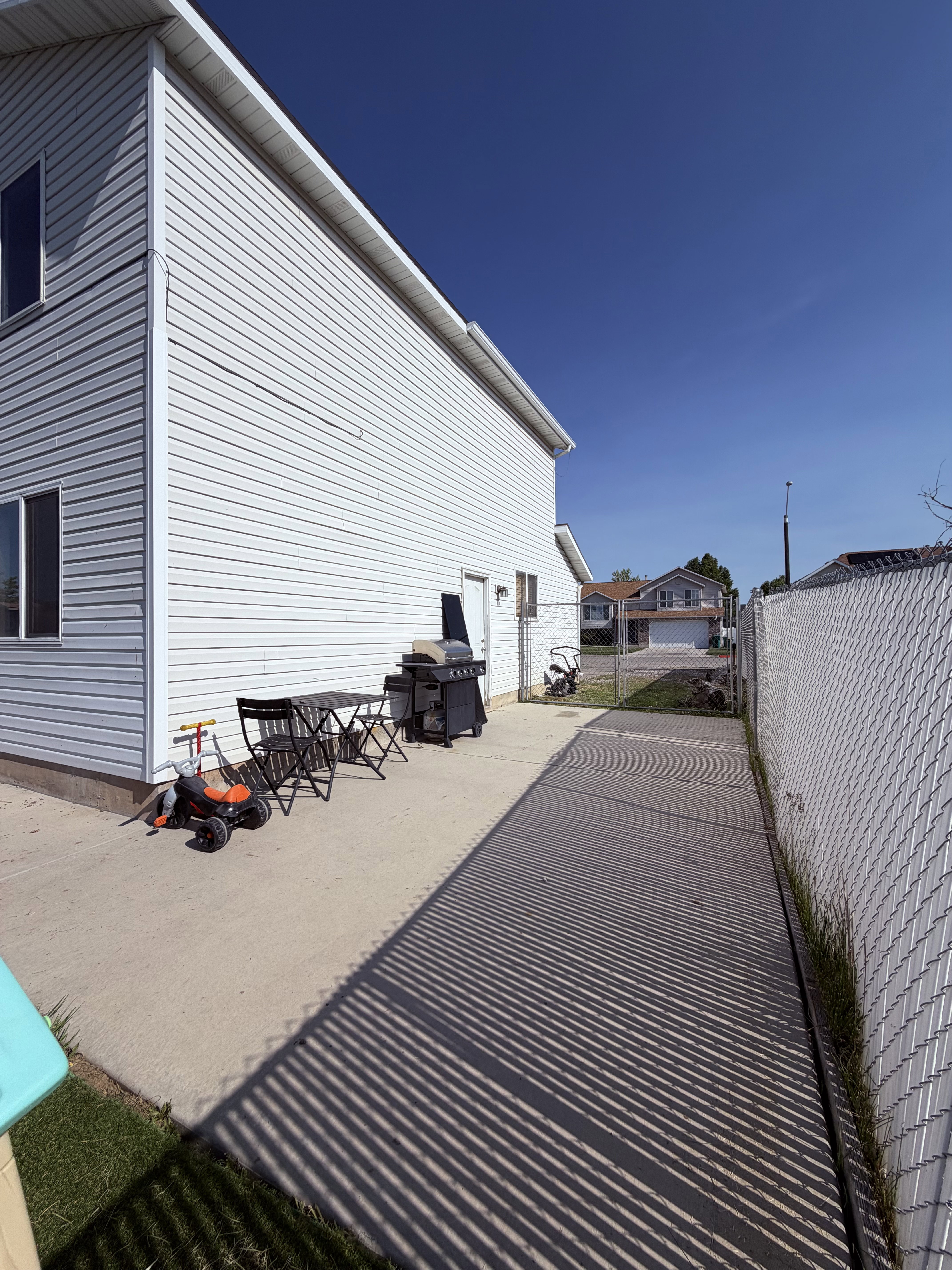 Exterior siding with multiple windows and a side entry door