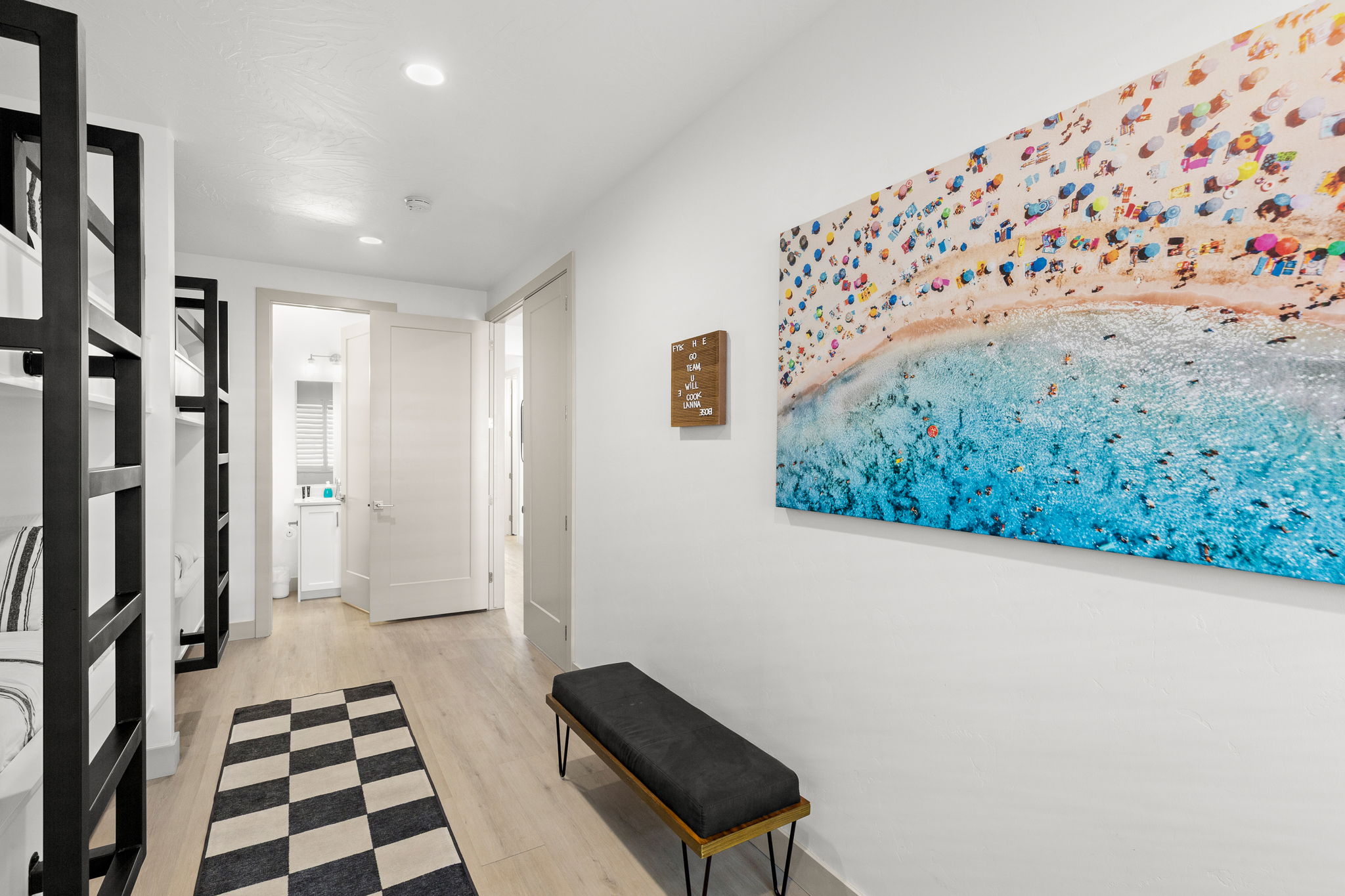 Hallway featuring wood-finish flooring, recessed lighting, and white walls