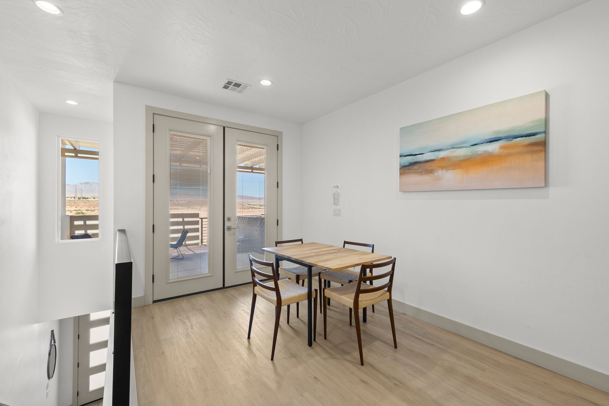 Interior space featuring light wood-finish flooring and recessed lighting