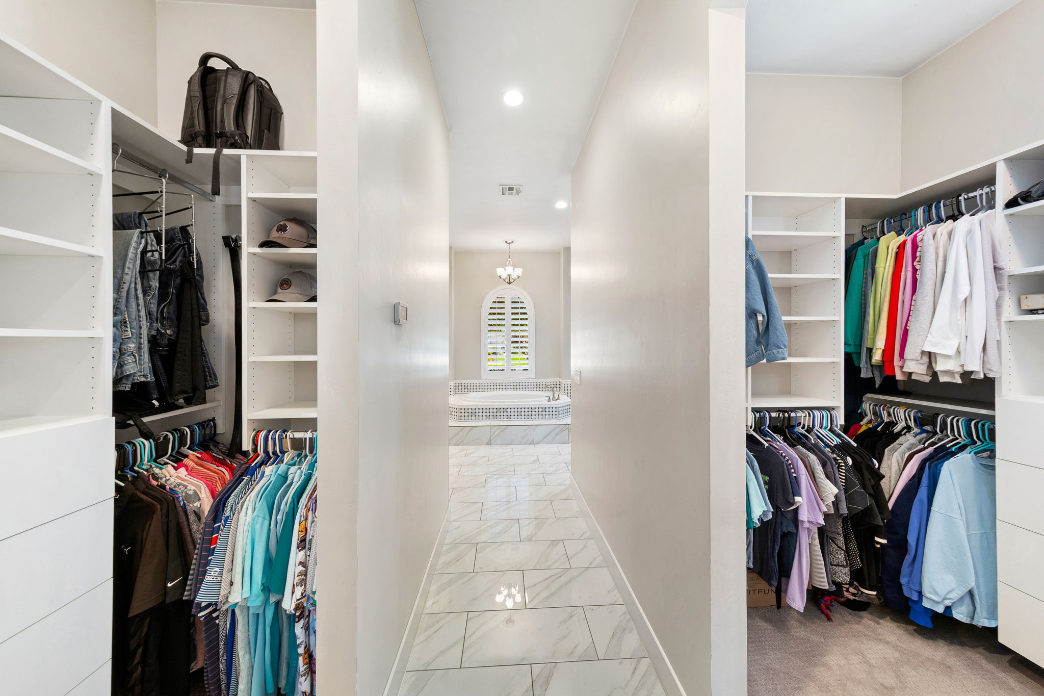 Custom closet systems with extensive shelving and hanging space