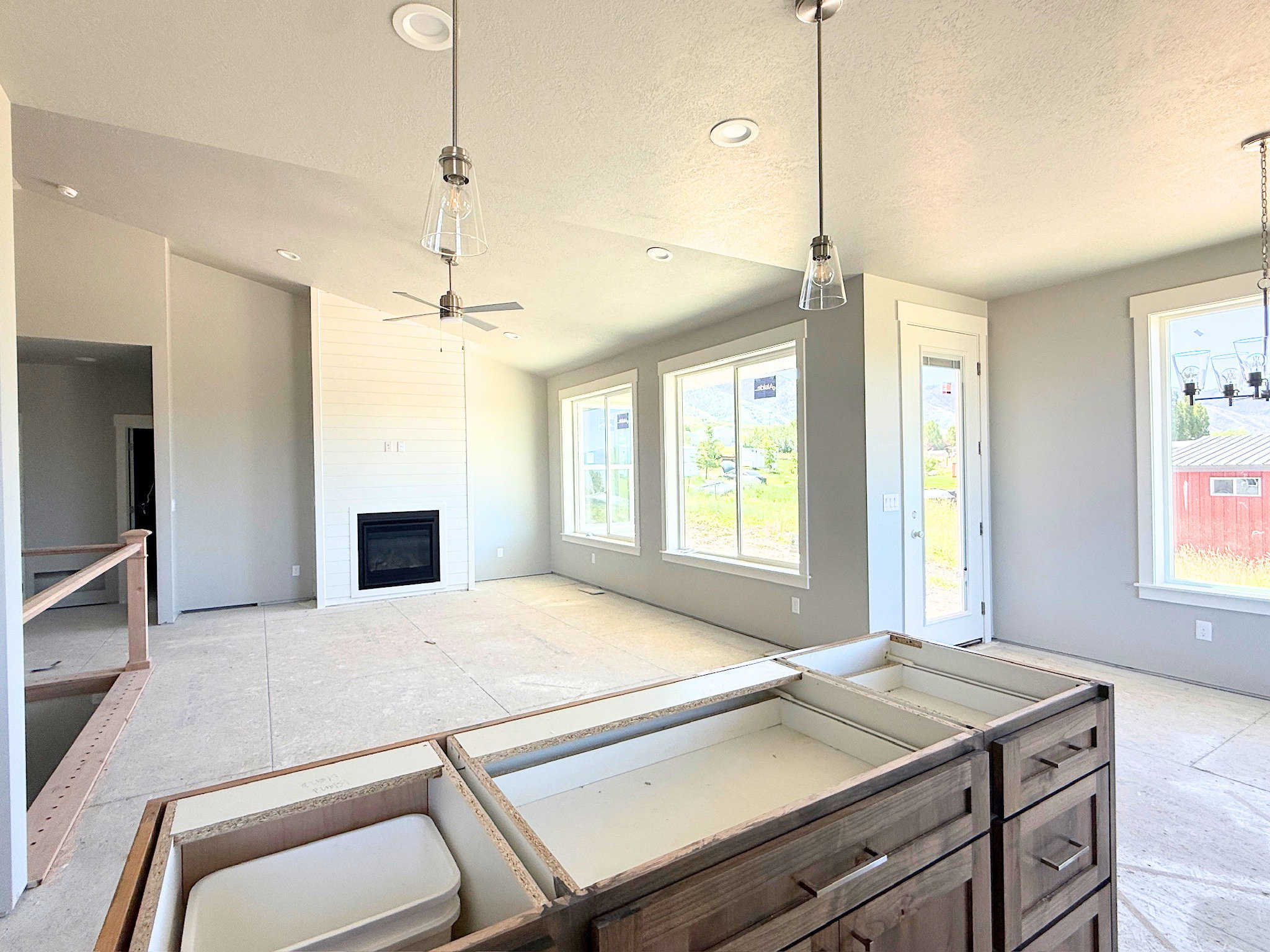 Vaulted ceilings featuring recessed lighting and pendant fixtures