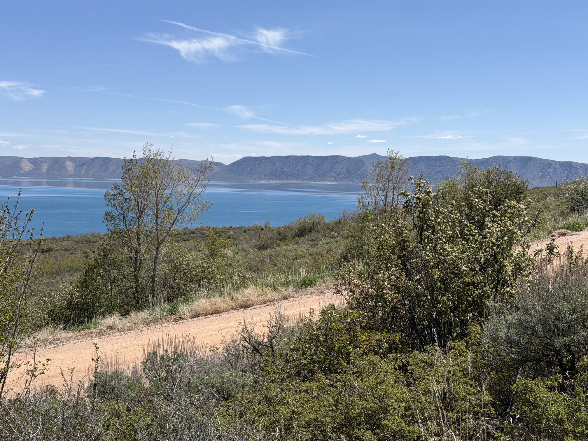 Expansive water body against a mountainous backdrop