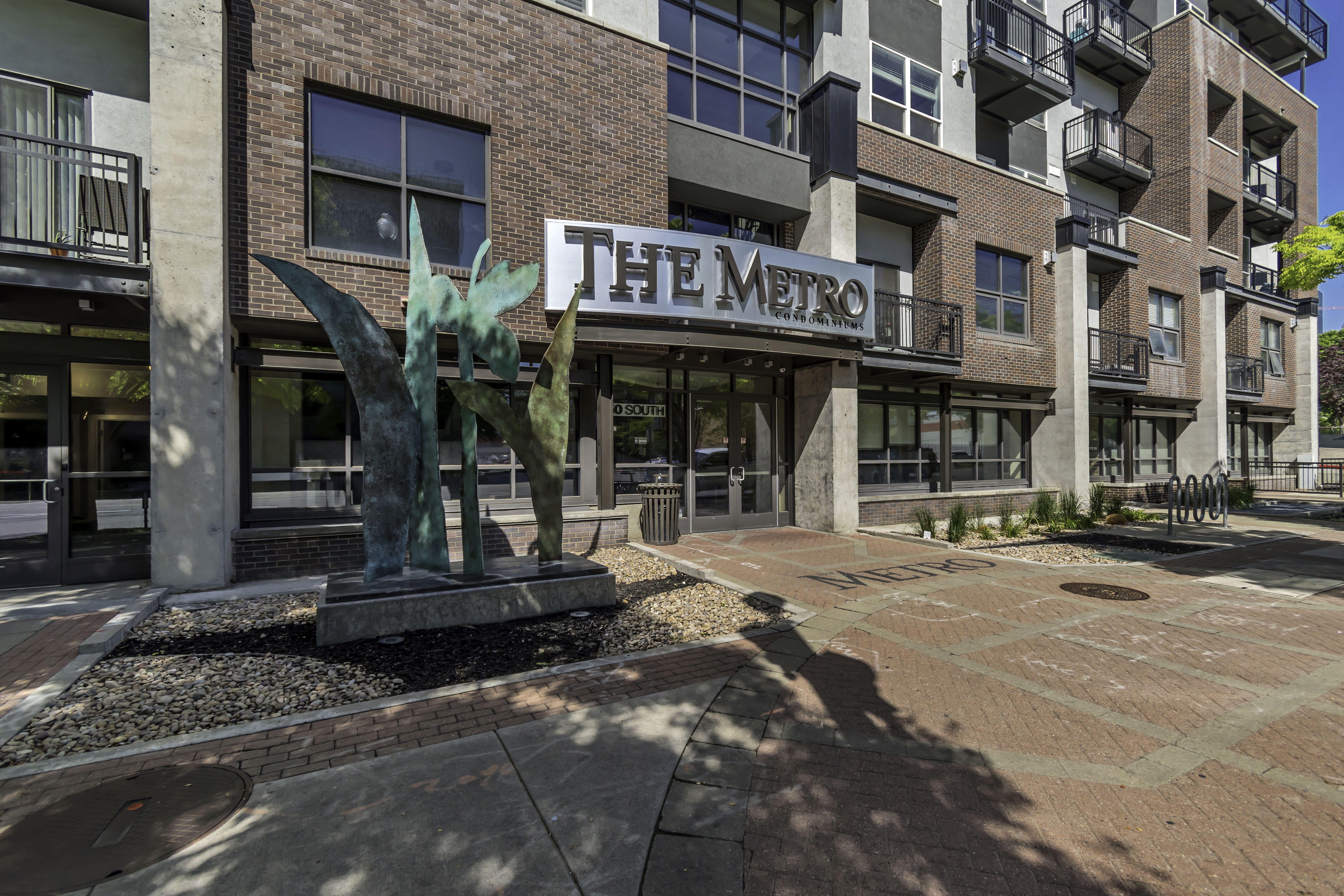 Brick and concrete facade building featuring a prominent entrance with "THE METRO" signage