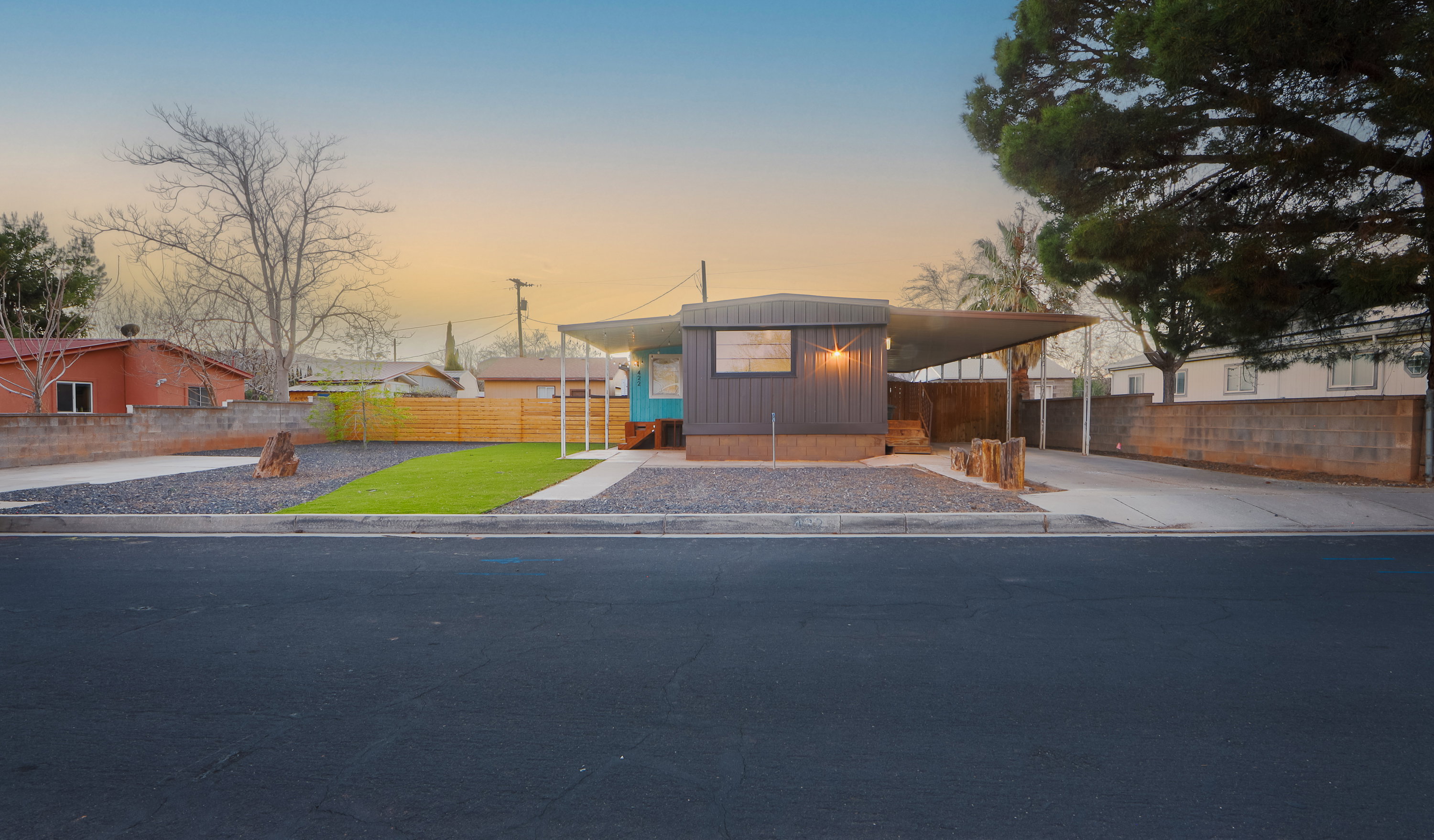 Manufactured / mobile home with an attached carport and driveway