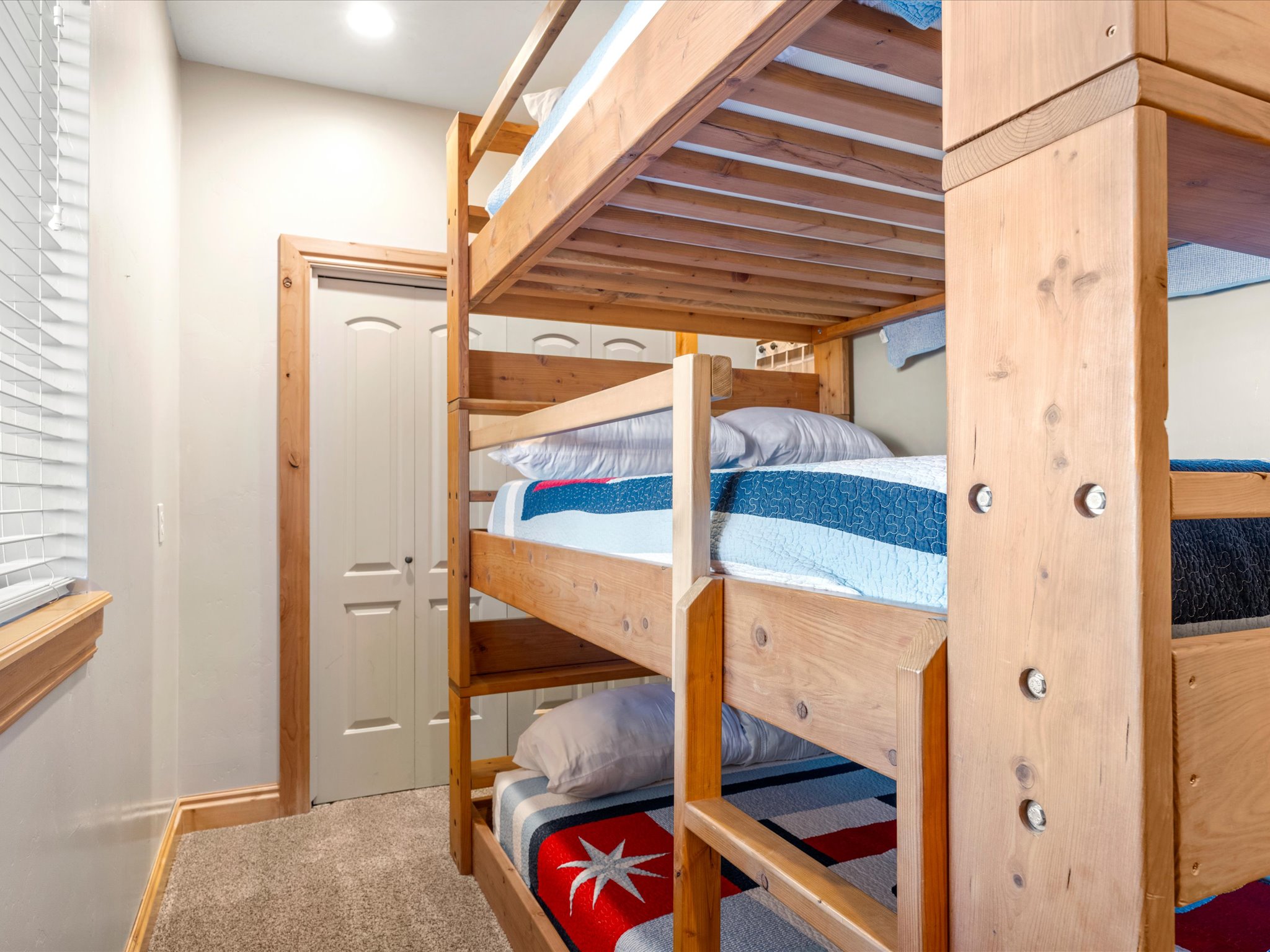 Custom-built wood bunk beds with integrated ladder