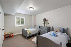 Recessed lighting, neutral wall paint, and plush carpeting create a versatile interior space
