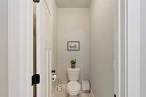 Primary bathrroom featuring light gray wall paint, white trim, and light wood-finish flooring