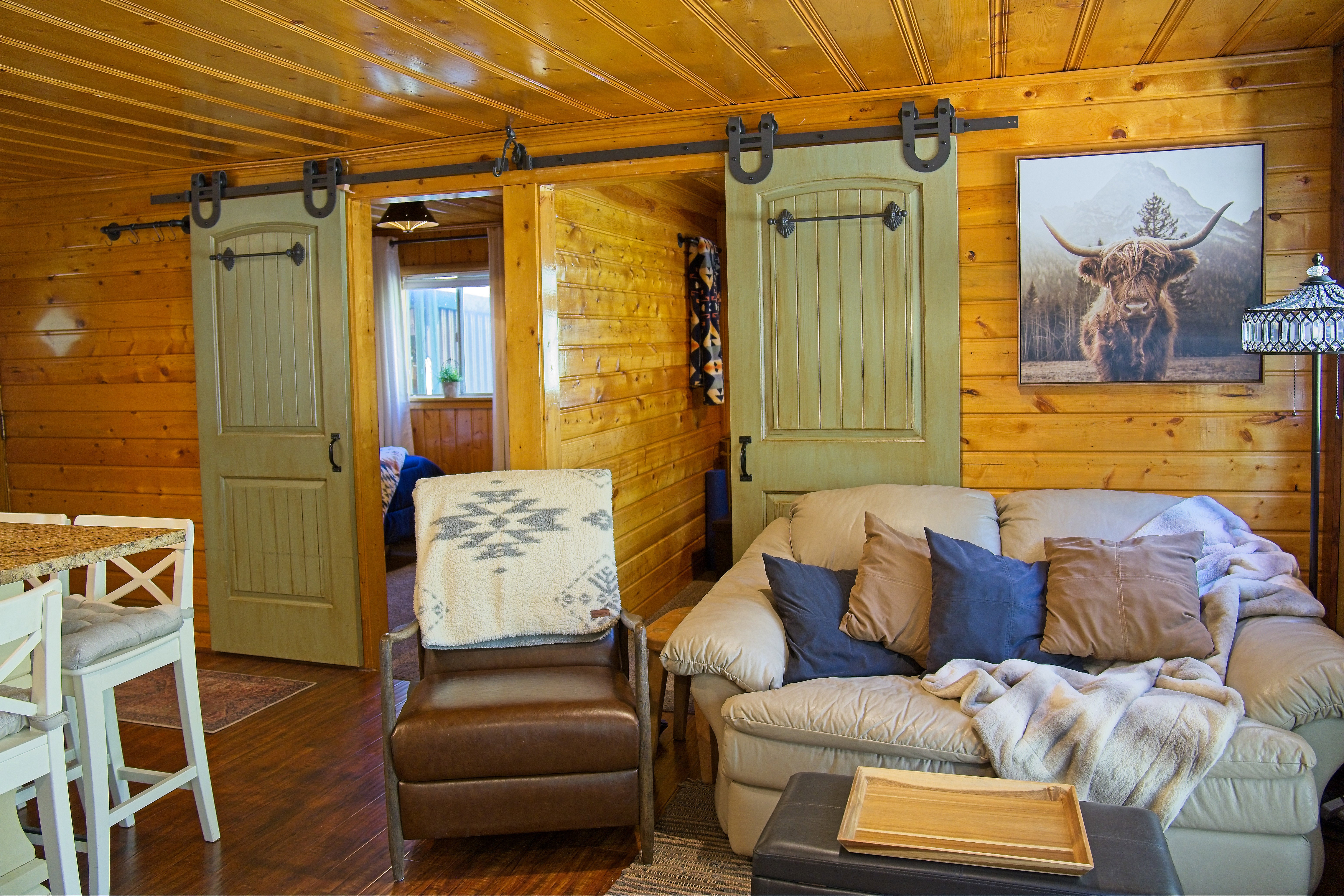 Interior space featuring full wood-paneled walls and a matching wood-paneled ceiling