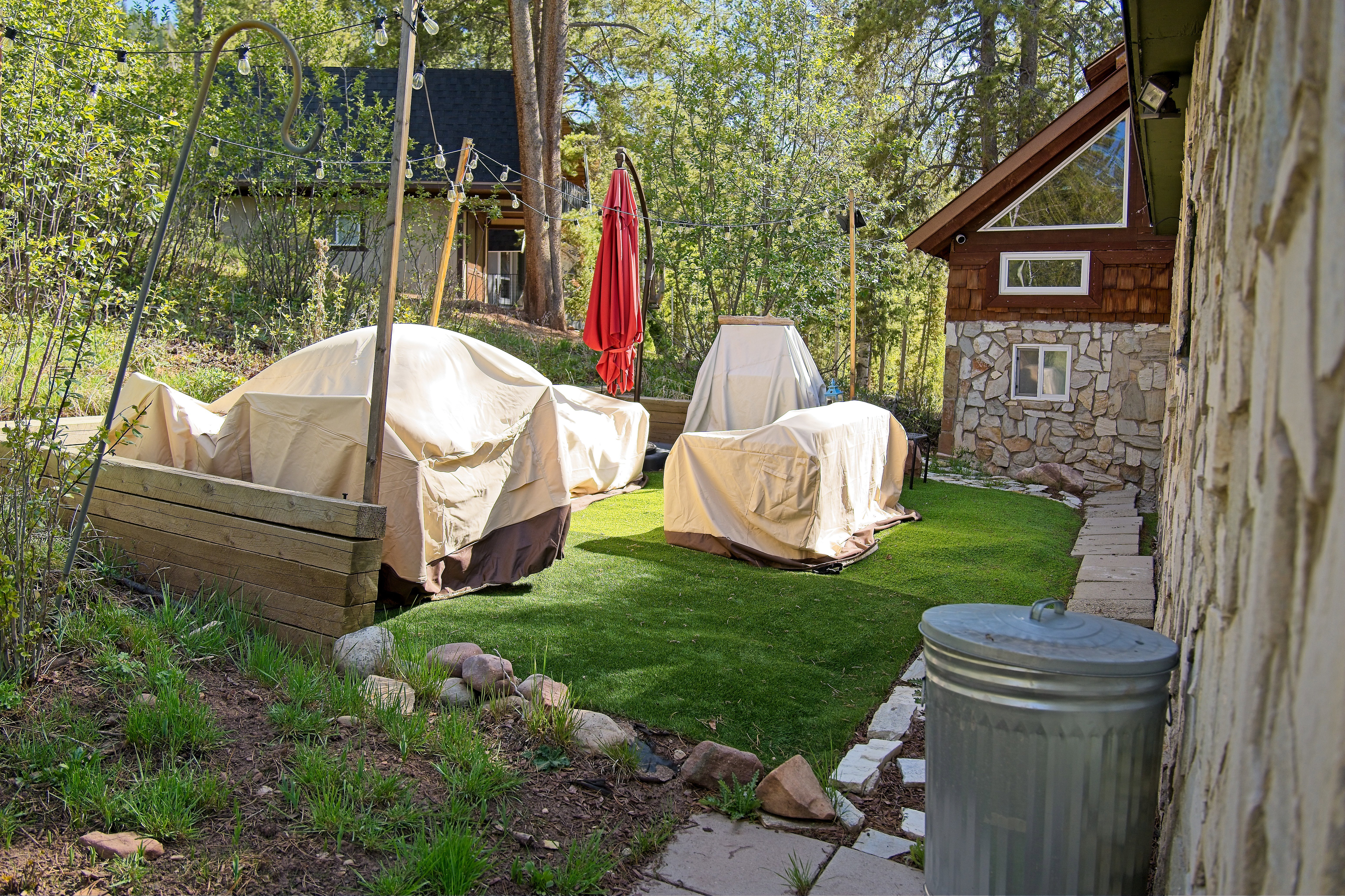 Expansive outdoor area featuring a manicured artificial turf lawn