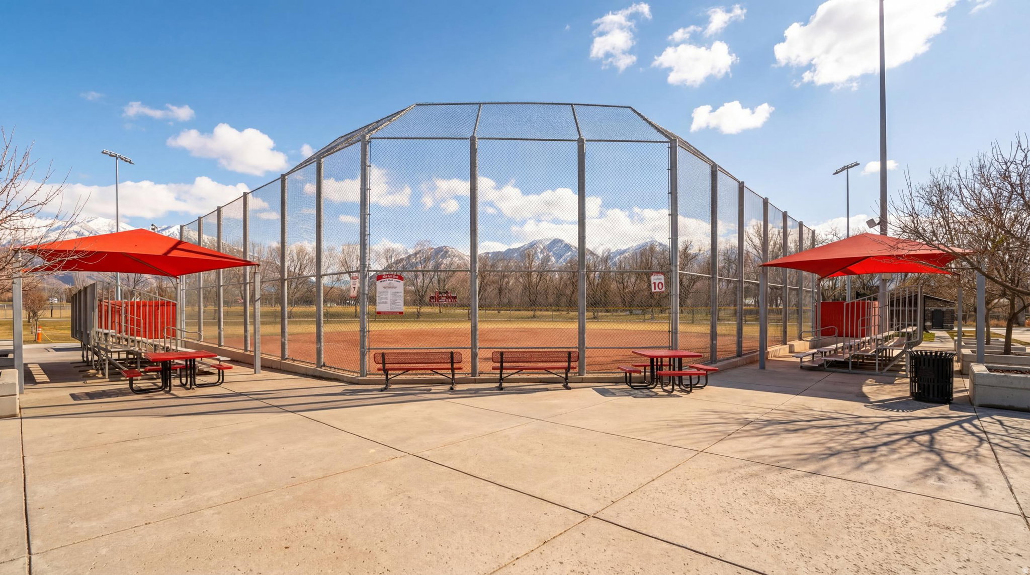 Baseball field with a chain-link backstop and outfield fencing