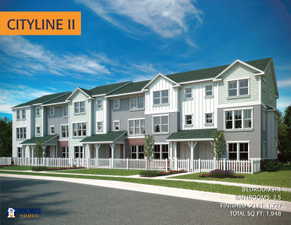 Modern townhome facade featuring a clean architectural design, vertical and horizontal siding, brick accents, white picket fencing, and manicured green spaces