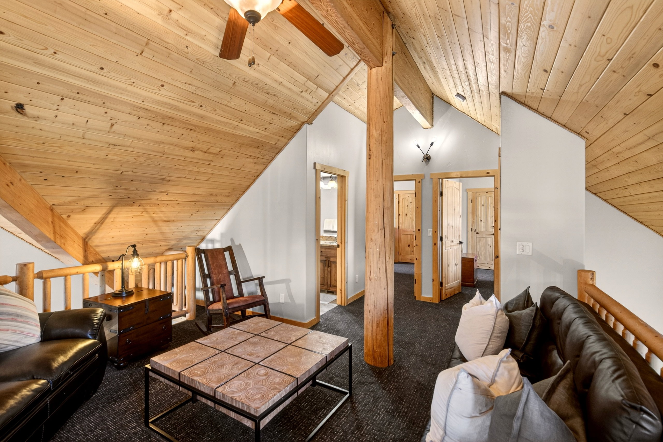 Vaulted wood-paneled ceiling with exposed beams