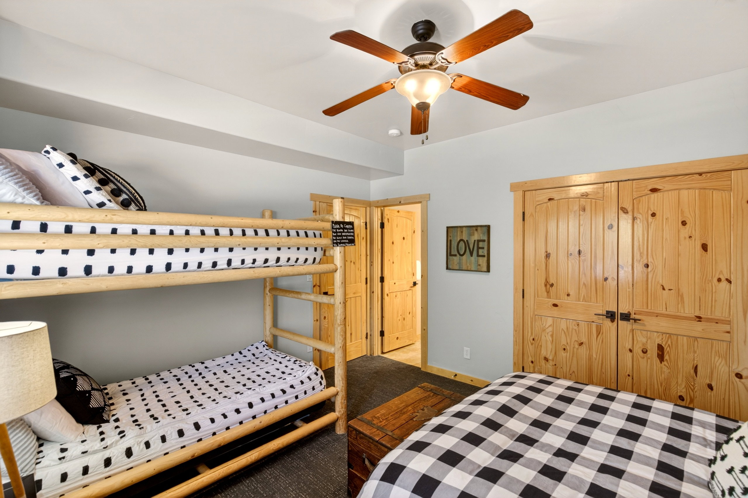 Room featuring light-colored walls and dark carpeting