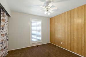 Accent wall with vertical wood paneling