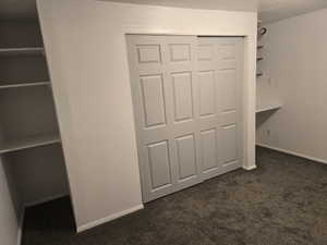 Gray sliding bifold closet doors with a paneled design
