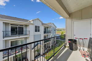 Private balcony featuring a concrete floor and black metal railing