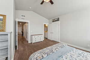 Bedroom featuring vaulted ceilings, carpet flooring, a ceiling fan, and white trim throughout