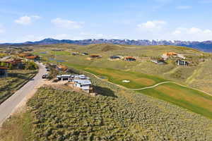 Expansive residential community with golf course frontage and distant mountain peaks