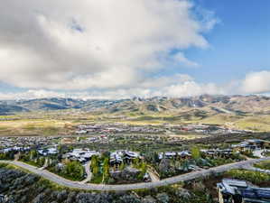 Expansive mountain landscape with scattered residential properties