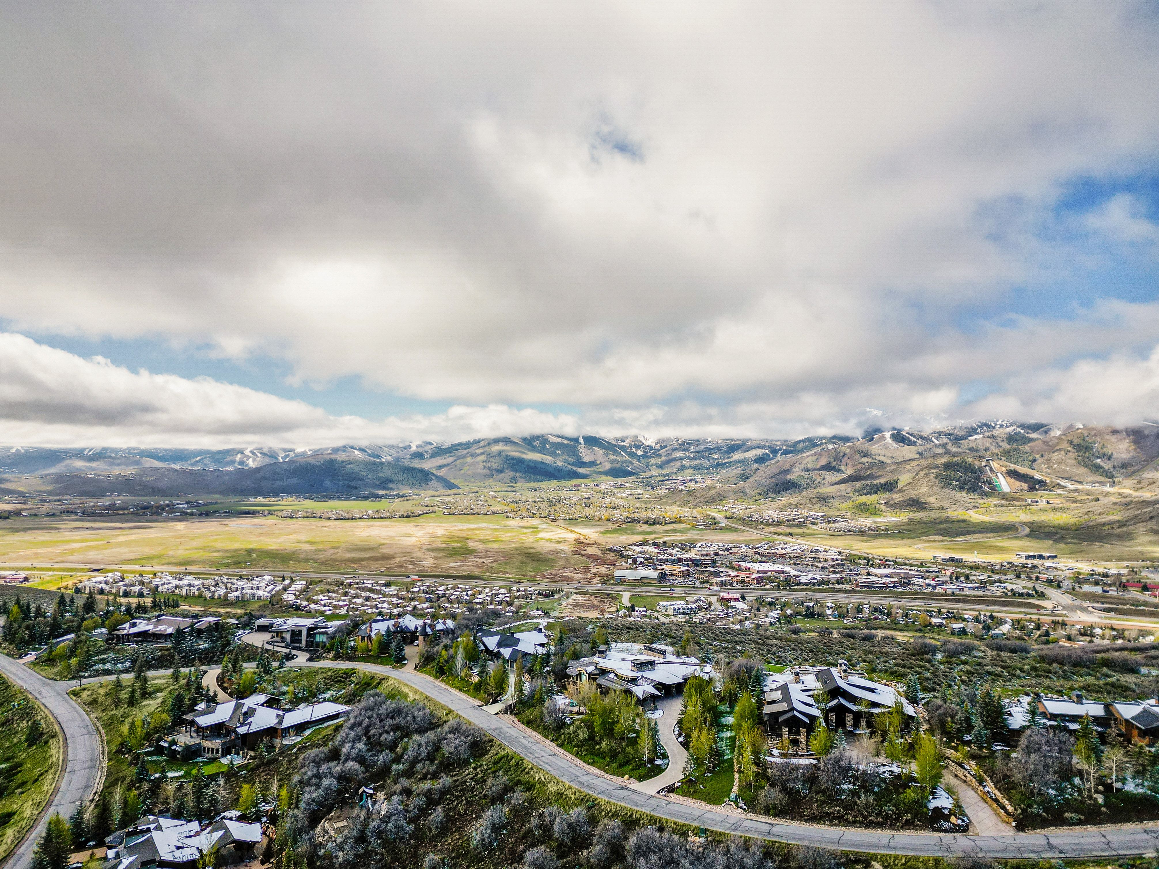 Expansive mountain landscape featuring distant snow-capped peaks