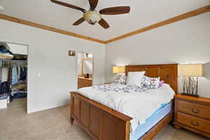 Bedroom featuring wood-finish ceiling trim, a ceiling fan, and tiled flooring